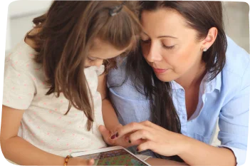 A teacher and parent collaborating while using a mobile application to facilitate seamless communication, representing tools like Educore and Arabee