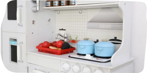 Interactive kitchen play area at Step By Step Nursery in Dubailand, promoting hands-on learning and imaginative exploration with structured activities.